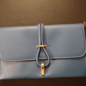 Blue clutch with strap.